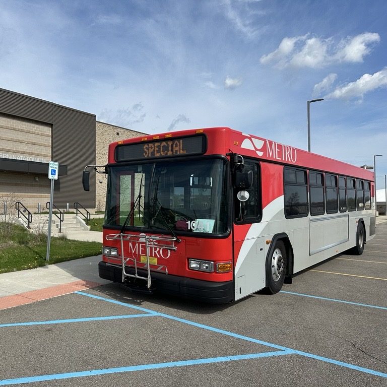 Metro Bus with the words Special on the front windshield marquee. The bus is parked in front of the Portage Northern Natatorium.